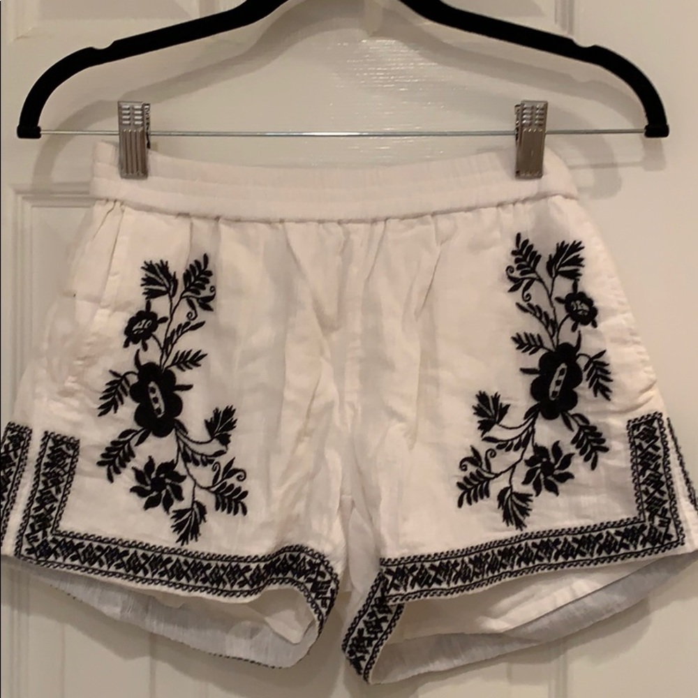 White and black embroidered shorts.